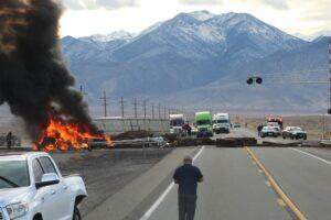 A man looking at a fatal semi truck accident